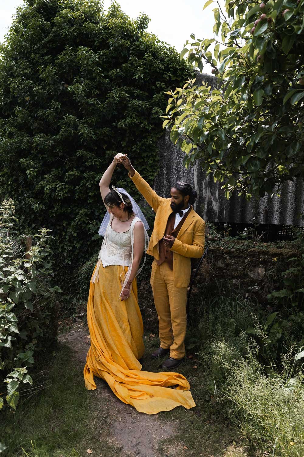 Photography of a yellow DIY wedding in a barn by London photographer Lauren Squire