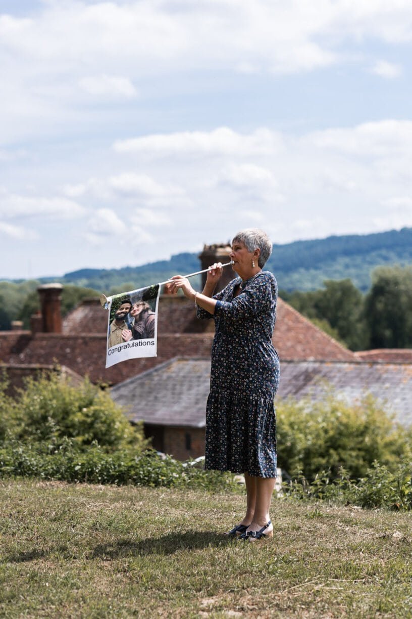 Photography of a yellow DIY wedding in a barn by London photographer Lauren Squire