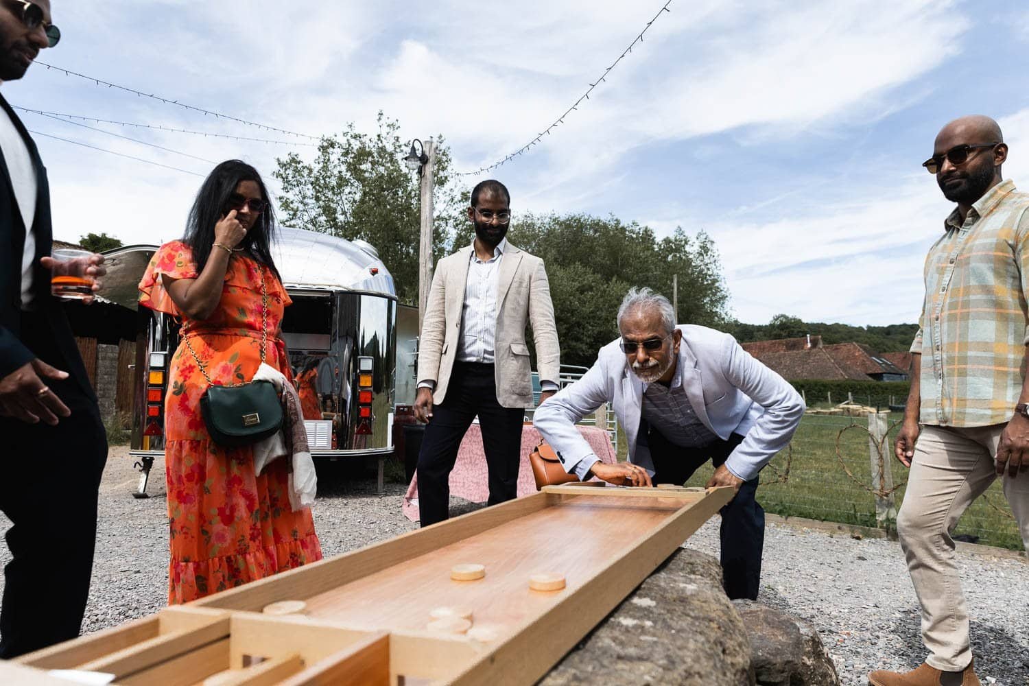 Photography of a yellow DIY wedding in a barn by London photographer Lauren Squire