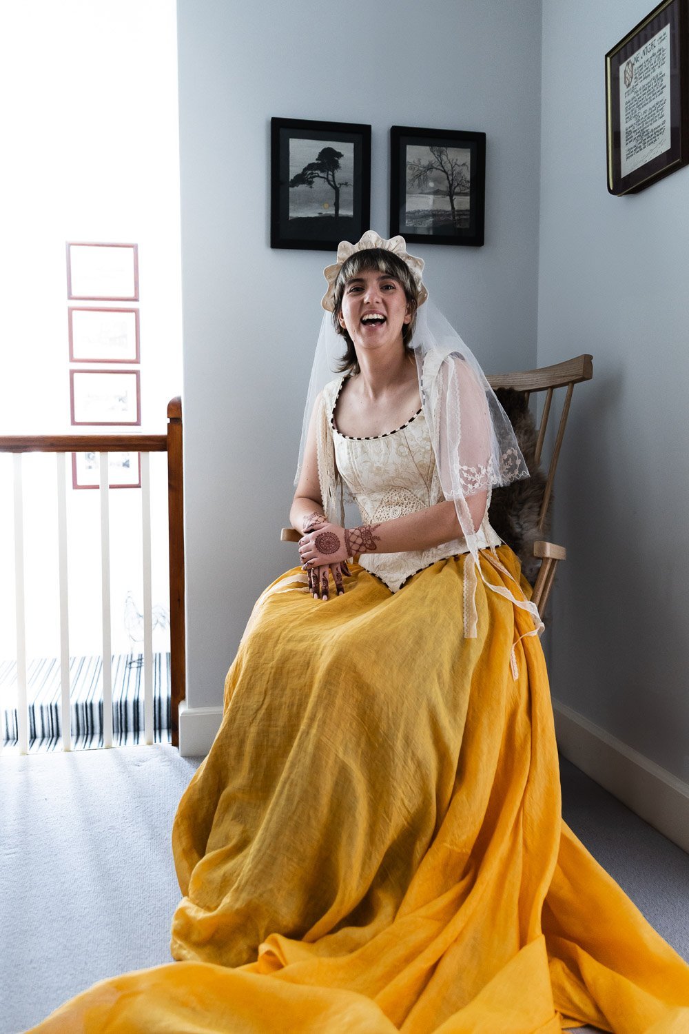 Photography of a yellow DIY wedding in a barn by London photographer Lauren Squire