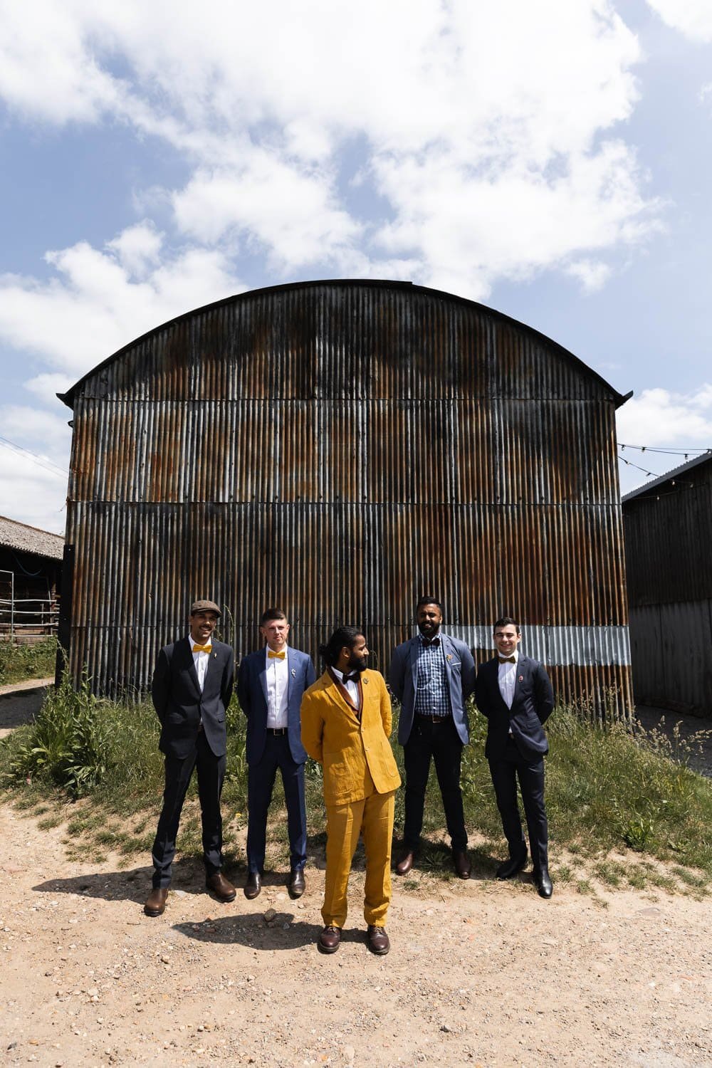 Photography of a yellow DIY wedding in a barn by London photographer Lauren Squire
